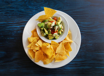chips and avocado and tomato dip
